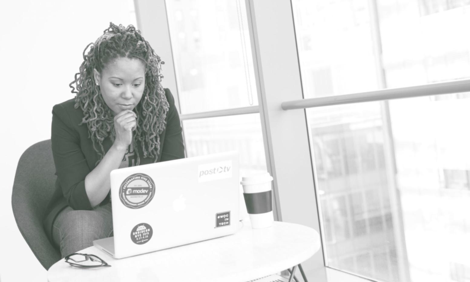 Design workshop session with instructor explaining user experience concepts on whiteboard